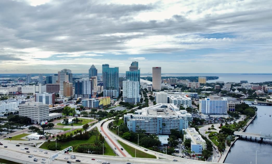 an aerial view of a city with tall buildings