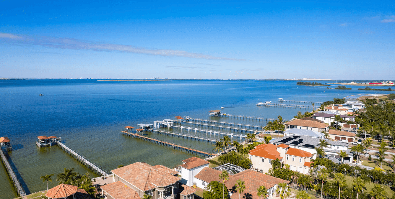 Aerial view of Apollo Beach waterfront homes and private docks on Tampa Bay
